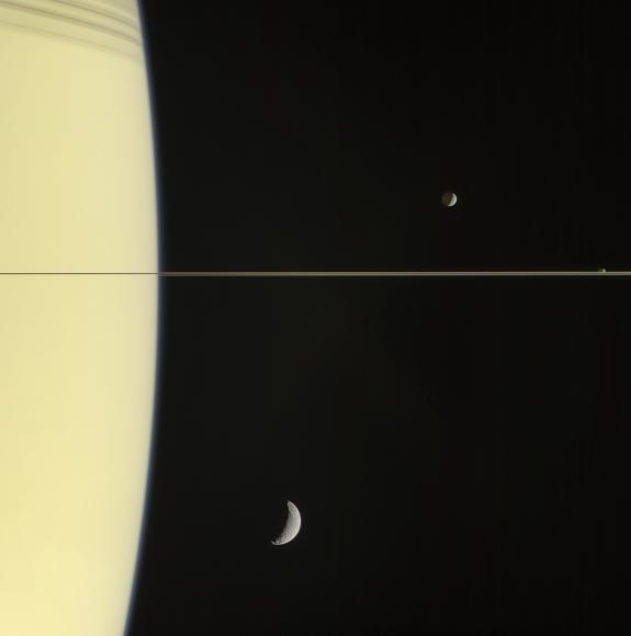 Saturn's rings are seen side on, with moons Mimas, Janus and Tethys.