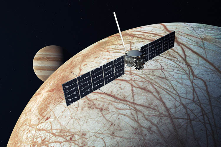 Artist's impression of NASA's Europa Clipper mission. The spacecraft can be seen flying above Europa, with Jupiter in the background.